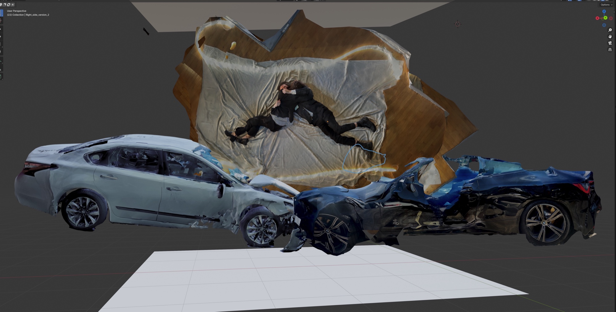 The photogrammetric assembly in 3D software: the two scanned drivers embracing above the two stitched-together crashed cars.